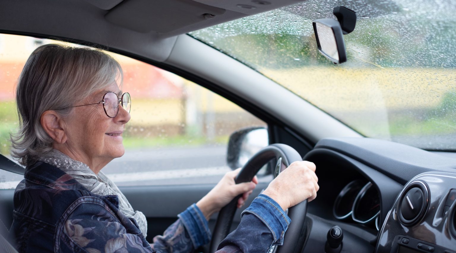 Older lady driving a car