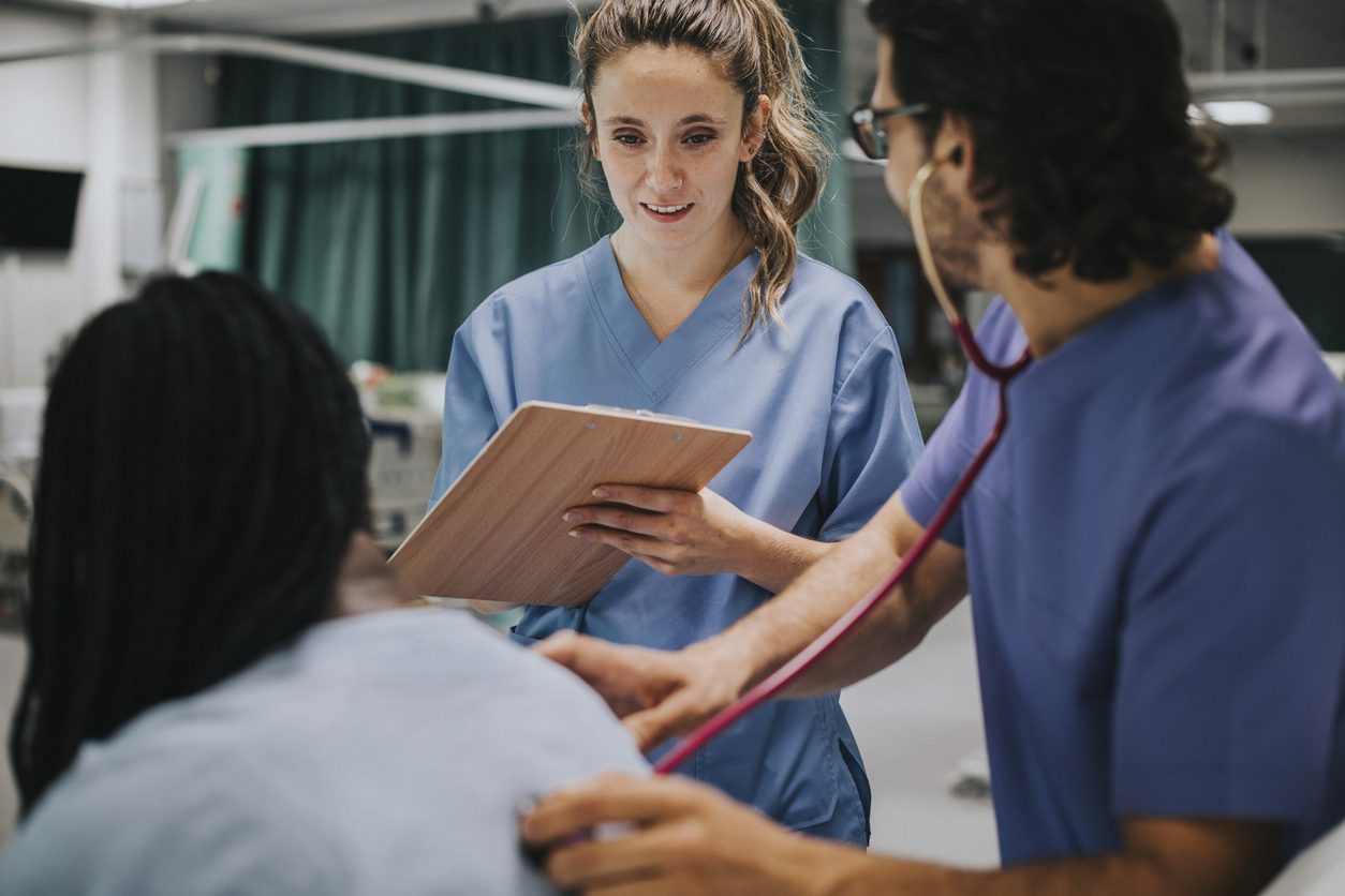 Young male physician examining a patient